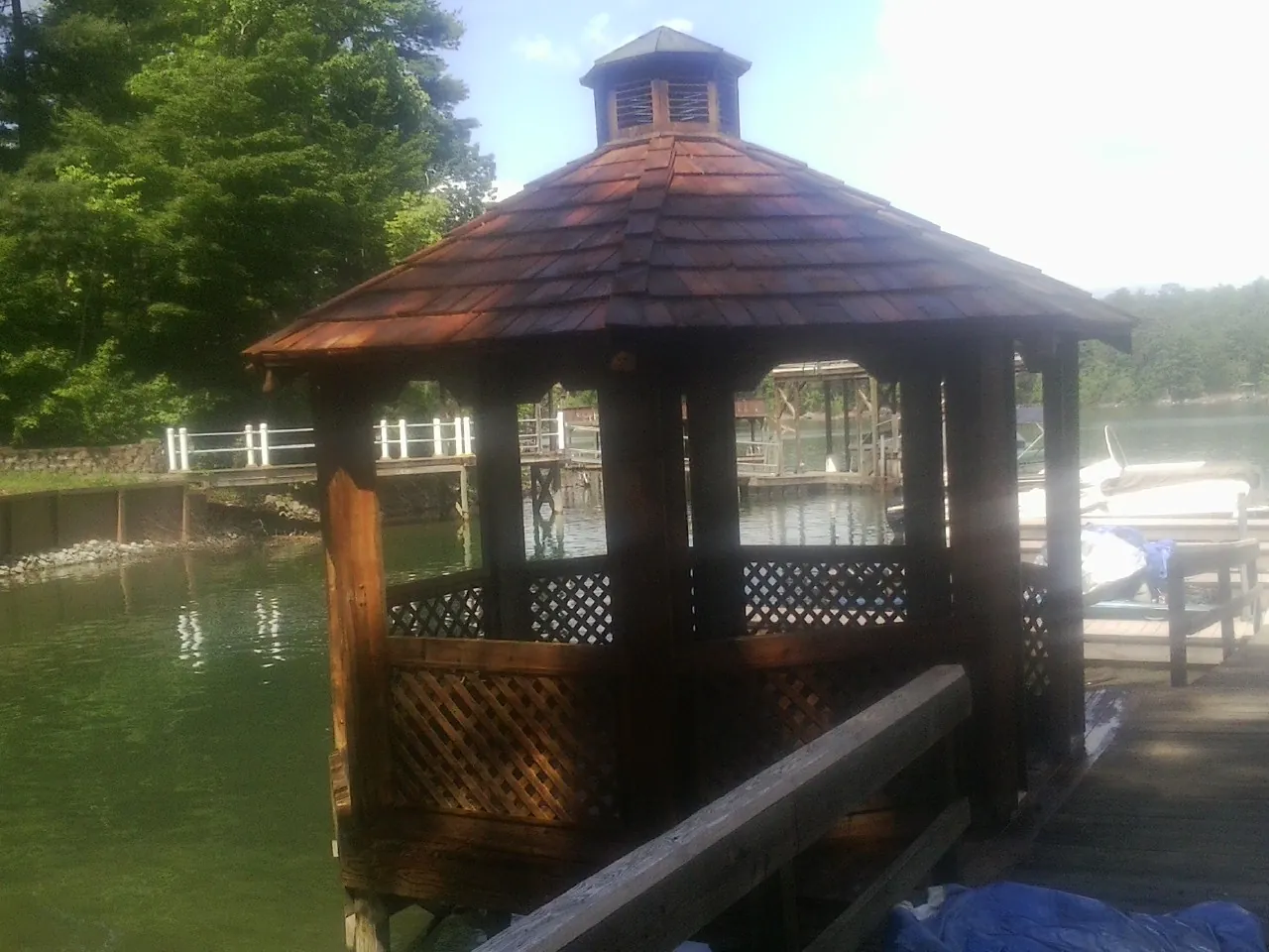 Cedar shake gazebo roof rebuilt on a lake dock in Knoxville